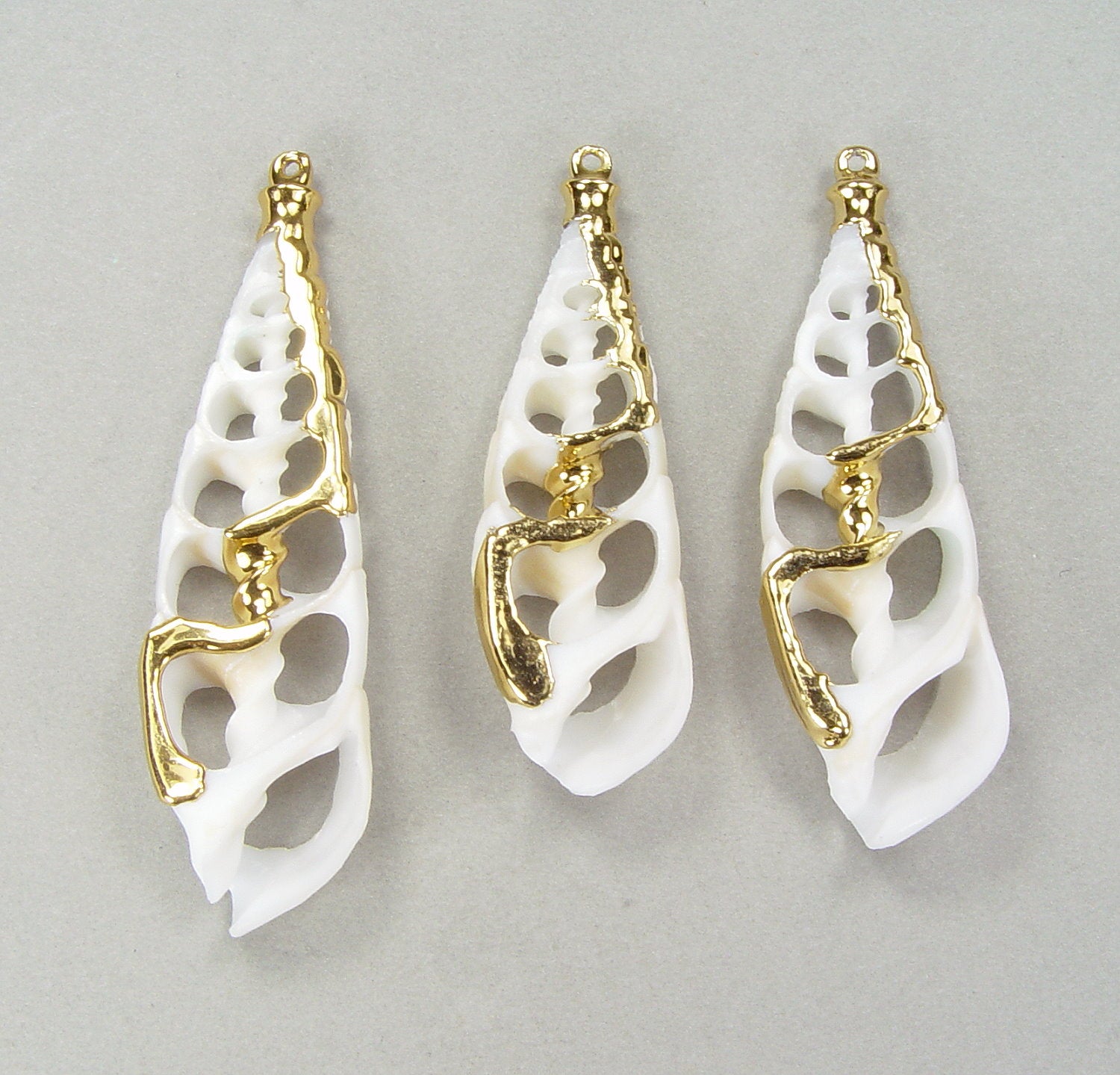Quantity Discounts: Long Sliced Shell Pendants